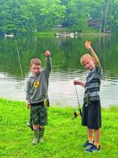 <b>Jaxon Babcock, 8, left, and his brother Brendon, 10, of Wantage show off the sunfish they caught in the fishing contest last year. (File photo by Greg Smith)</b>