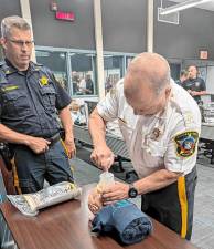 <b>Sussex County Sheriff Michael Strada shows how the LifeVac is used in choking emergencies. (Photos provided)</b>