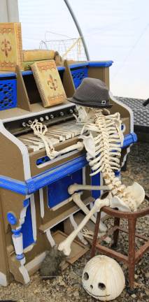 A skeleton plays the piano at PumpkinFest.