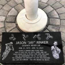 <b>Removed earlier this year, the stone at the foot of the pump track flagpole honoring Jason Rinker will be reinstalled. (Photos courtesy of Sally Rinker)</b>