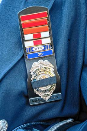 <b>James McCarthy wears a First Responder World Trade Center medal.</b>