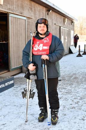 Johnathan Blakely of Sussex poses with his skiing equipment.