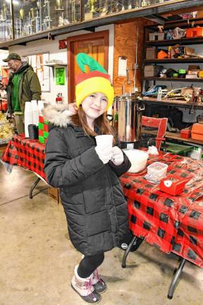 <b> Morgan McCabe holds hot chocolate.</b>