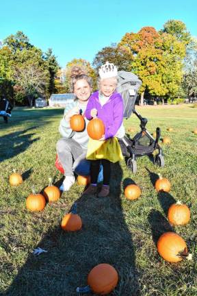 <b>Kristen and Vivienne Mathes of Newton in the pumpkin patch at Norwescap’s Fall Frolic in the Park.</b>