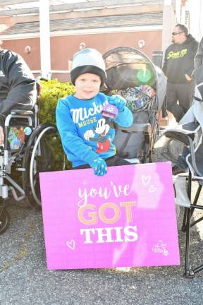 <b>Brian Savely of Hamburg holds a sign saying ‘You’ve got this.’</b>