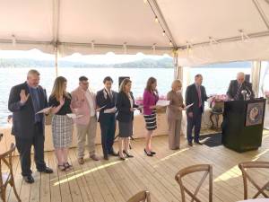 Newly elected officers and trustees take their oaths of office before Judge McGovern. L-R: Vice President Brent Rafuse, Trustee Nicole Tracy, Trustee Travis Nunziato, Trustee Shan Kadkoy, Secretary Diane Hein, Trustee Vanessa Henderson, Trustee Dina Mikulka, and Treasurer Dan Perez.