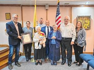 <b>Lillian Yeomans of Wantage celebrated her 100th birthday Oct. 10. She was presented with a proclamation by Mayor William Gaechter at the Township Committee meeting Oct. 24. (Photo provided)</b>