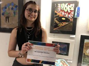 Dee Albayrek, a junior at Wallkill Valley Regional High School, won first place in the mixed media/open category of the high school art show. She also was offered a scholarship to a summer program at Montserrat College of Art in Beverly, Mass. (Photos by Kathy Shwiff)