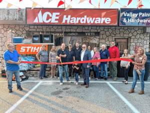 <b>Martin O’Donnell, left, and Stephanie Scilingo of the Vernon Chamber of Commerce hold a ribbon as Dave Ferguson cut it at the reopening of Ace Hardware in Vernon on Friday, Sept. 13. From left are Jackie Vitiello, Caroline Ferguson, Don Ferguson, Don Ferguson Jr., Mayor Anthony Rossi, Laura Ferguson, Debbie and Bo Ferguson, Ace district manager Scott Schneider and Marissa Rossi. (Photo provided)</b>