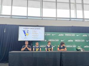 <b>Vernon Township High School head football coach Steve Down, left, with players Matt Baumann, Aden Karwoski and Luca Vizzini on Aug. 6 at a High School Football Media Day at MetLife Stadium. (Photo by Aidan Mastandrea)</b>