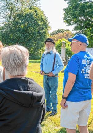 SCH1 Geoffrey Ithen leads a tour of the Old Newton Burial Ground. (Photos by Nancy Madacsi)