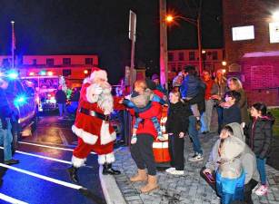 <b>Santa greets residents as he arrives for the Christmas tree lighting Friday, Nov. 29 at Deckertown Commons in Sussex Borough.</b> (Photos by Maria Kovic)