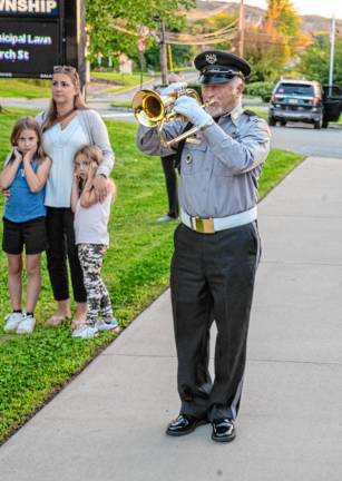 <b>VC5 Robert Caggiano of Bugles Across America plays taps.</b>