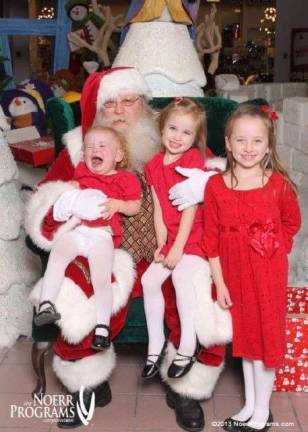 Submitted by: Jennifer Devine of Monroe, N.Y. &quot;While visiting Santa, Addyson (21 months) was not concerned with making it on the good list. Her big sisters, Jillian (7) and Brielle (4), knew to keep looking at the camera and smile. They weren't taking a chance on getting on the naughty list!&quot;