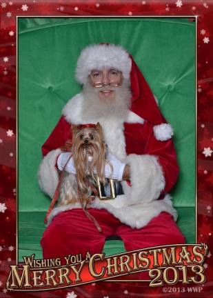 Submitted by: Claudia Adams of Lords Valley, Pa. &quot;Every year, my little girl Twinkie loves to see Santa. She especially loves to eat his beard!&quot;