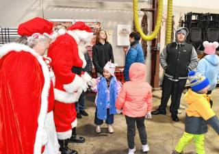 <b>Santa and Mrs. Claus greet children inside the firehouse Friday, Dec. 6 in Vernon. (Photo by Maria Kovic)</b>