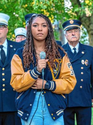 <b>VC2 Ali Thomas sings the National Anthew and ‘God Bless America’ during the ceremony.</b>