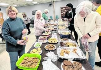 Every February, Vernon Township Woman’s Club members bake their favorite cookies to give away. This year, they made an estimated 2,500 cookies, including sugar-free varieties. The cookies were packaged with a tag saying, ‘With love from the Vernon Township Woman’s Club.’ They were delivered to residents of the Homestead Rehabilitation and Health Care Center in Newton and to DASI’s domestic abuse shelter. (Photo provided)