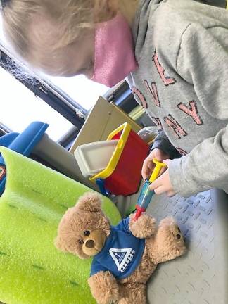 Maddy vaccinates the school mascot, Hank (Photo provided)