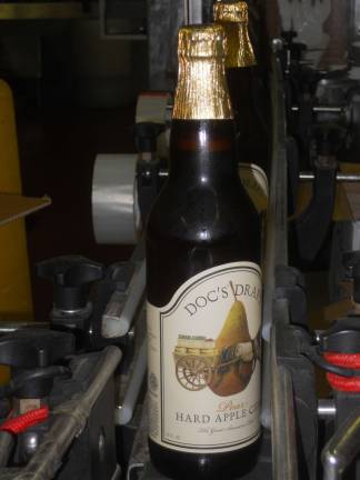 Photo by Alexis Tarrazi Labels for Doc's Draft have been freshly pressed onto the bottles.