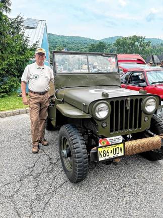 1946 Willys Jeep CJ2A owner Steven Gluck of Vernon. He said this was the first year of the civilian model.