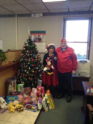 From left, Mary Morrell, branch sales manager at Sussex Bank&#x2019;s Montague branch and Robert Bensen, who oversees the organizing and collecting of Toys for Toys in Montague.
