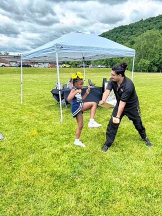 Kelah Ventour, who is a black belt at United Martial Arts Centers in Vernon, and master instructor Joe Rodriguez give a demonstration at Vernon Day 2024 on Saturday, June 8. (Photo by Daniele Sciuto)