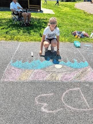 Greycey Steady, 12, of Highland Lakes with her drawing.