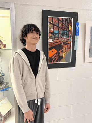 Wallkill Valley student Marcus Bui with ‘Leaning on the Edge,’ which won first place in the 2D Mixed Media/Open category. The work also earned him a $25,000-a-year scholarship at Hartford Art School. (Photo provided)