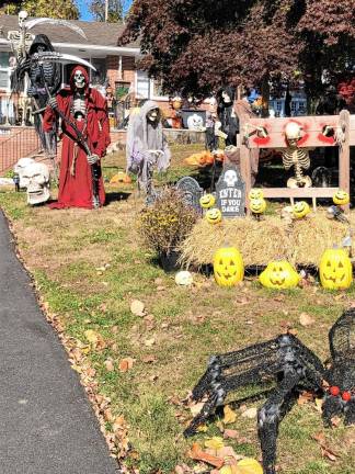 <b>Dozens of figures are set up in front of this home at Main and Clarkson streets in Newton. (Photo by Kathy Shwiff)</b>