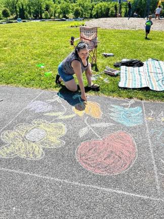 Josphine Reyes of Elmwood Park was drawing along with her daughter Janely Zayas and granddaughter Jaliann Castillo.