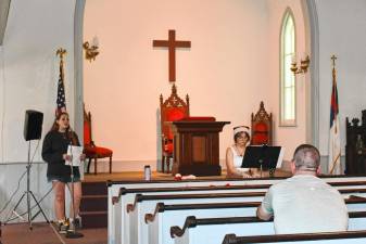 <b>High Point Regional High School graduates Felicity Schmitt, left, and Bea Patrie perform in the Christmas in July Sing-along on Saturday, July 13 at the Old Clove Church in Wantage. (Photos by Maria Kovic)</b>