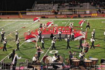 <b>The Vernon Township High School Marching Band and Color Guard perform during halftime of the game with Mount Olive on Oct. 11</b>. (Photos by George Leroy Hunter)