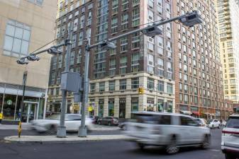 Recently installed toll traffic cameras hang above West End Ave. near 61st Street in the Manhattan borough of New York, Friday, Nov. 16, 2023. The start date for the $15 toll most drivers will be charged to enter Manhattan's central business district will be June 30, transit officials said Friday, April 26, 2024. (AP Photo/Ted Shaffrey, File)