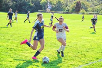 <b>Vernon's Grace Dobrzynski (23) and Newton's Vanessa De Stefano (25) pursue the ball in the girls soccer game Sept. 4 in Vernon. Dobrzynsk scored two goals, and the Vikings won, 6-1. (Photos by George Leroy Hunter)</b>