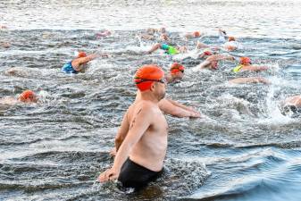 Swimmers begin the first leg of Pass It Along’s Triathlon on Saturday, July 27 at Lake Mohawk in Sparta. (Photo by Maria Kovic)