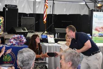 Rep. Josh Gottheimer, D-5, presents a flag flown over the U.S. Capitol to the Sussex County Senior of the Year, Annete Grieco of Hopatcong. (Photo provided)