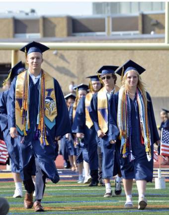 Vernon Township High School salutatorian Zack Mountain and valedictorian Bailey Mann lead the Class of 2024 into graduation Wednesday, June 19. (Photo by Theresa Sabia)