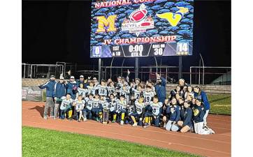 <b>The Vernon Youth Football &amp; Cheer JV team defeated Madison, 14-0, in the Morris County Youth Football League’s National Conference Championship. It is the first MCYFL trophy won by a Vernon team. (Photo provided)</b>