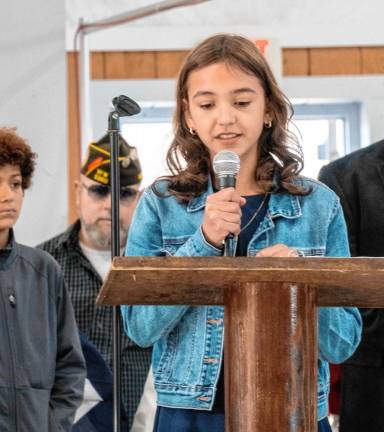 <b>Maya Mianowski, an eighth-grader at Ogdensburg School, reads her winning essay.</b>