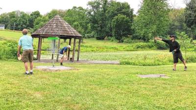 <b>Residents practice before the disc golf tournament begins June 29 at Papakating Park in Wantage. (Photos by Kathy Shwiff)</b>