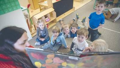 Little Sprouts Early Learning Center teacher Leann Eaton reads to the preschool class.