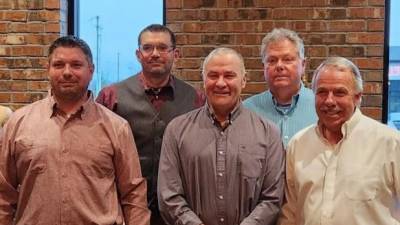 Members of the R.S. Phillips Steel family honor longtime employee Stephen Ahern during a dinner celebration. Front row from left are Neil Phillips, Stephen Ahern and Reginald Phillips; back row from left are Scott Phillips and Steven Phillips.