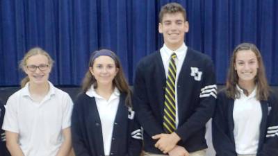 Pope John XXIII Regional High School Class of 2020 graduates (from left) Ashley Potts, Emily Mundt, Douglas Fowler, and Bridget McNally during the school’s monthly liturgy last October. They were among Pope John’s 67 students recognized for their outstanding achievement on the 2020 AP exams. (Photo by Anthony Spaulding/Director of Communications)