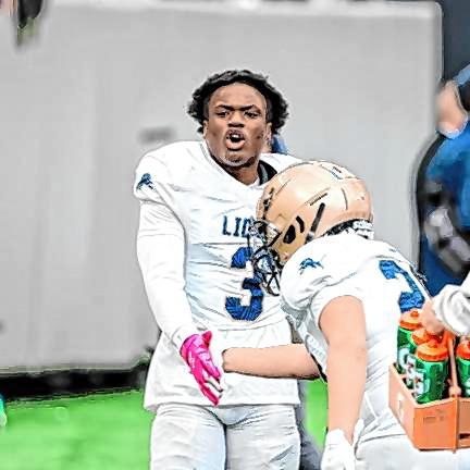 Tylik Hill yells in celebration on the Lions sideline after his second-half touchdown Nov. 29.