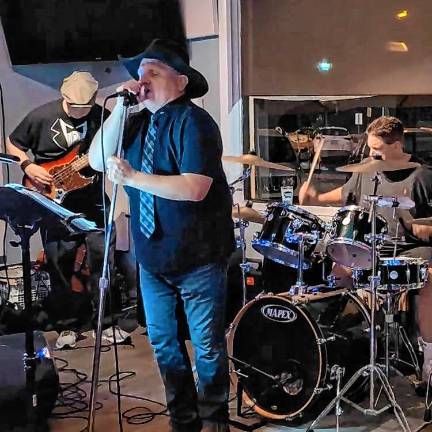 <b>The Hitsmen will play rock ‘n’ roll hits Saturday night at Brick &amp; Brew in Franklin. (Photo courtesy of the Hitsmen)</b>