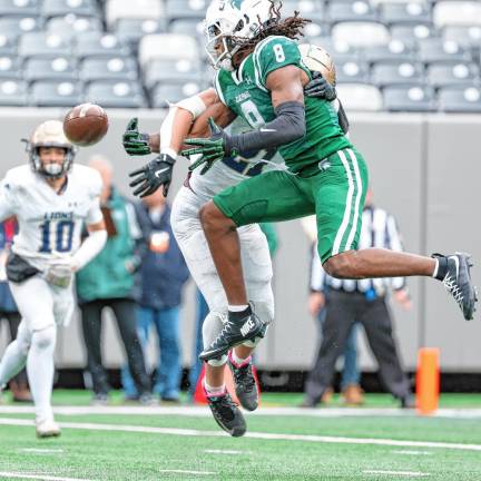 Pope John’s Andrew Sanchez breaks up a long pass intended for DePaul’s De’zie Jones.