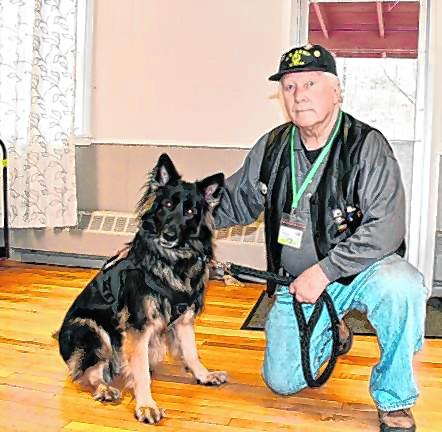 <b>Kenneth Augustin of Lafayette poses with his service dog, Remi, at a Veterans Welcome Home Day lunch March 28. The lunch was hosted by the Karen Ann Quinlan Hospice. (File photo by Maria Kovic) </b>