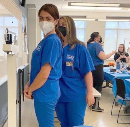 Students in the Medical Assistant program practice their medical training. (Photo by Kathleen Peterson)