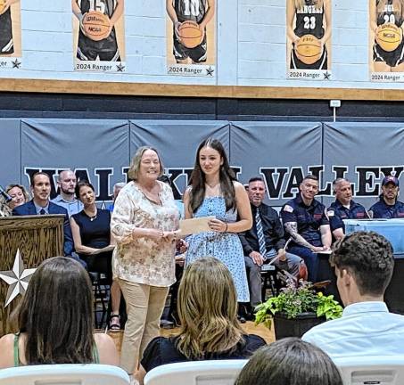 <b>WV1 Lily Tobatchnick receives a scholarship from Valerie Seufert.</b>